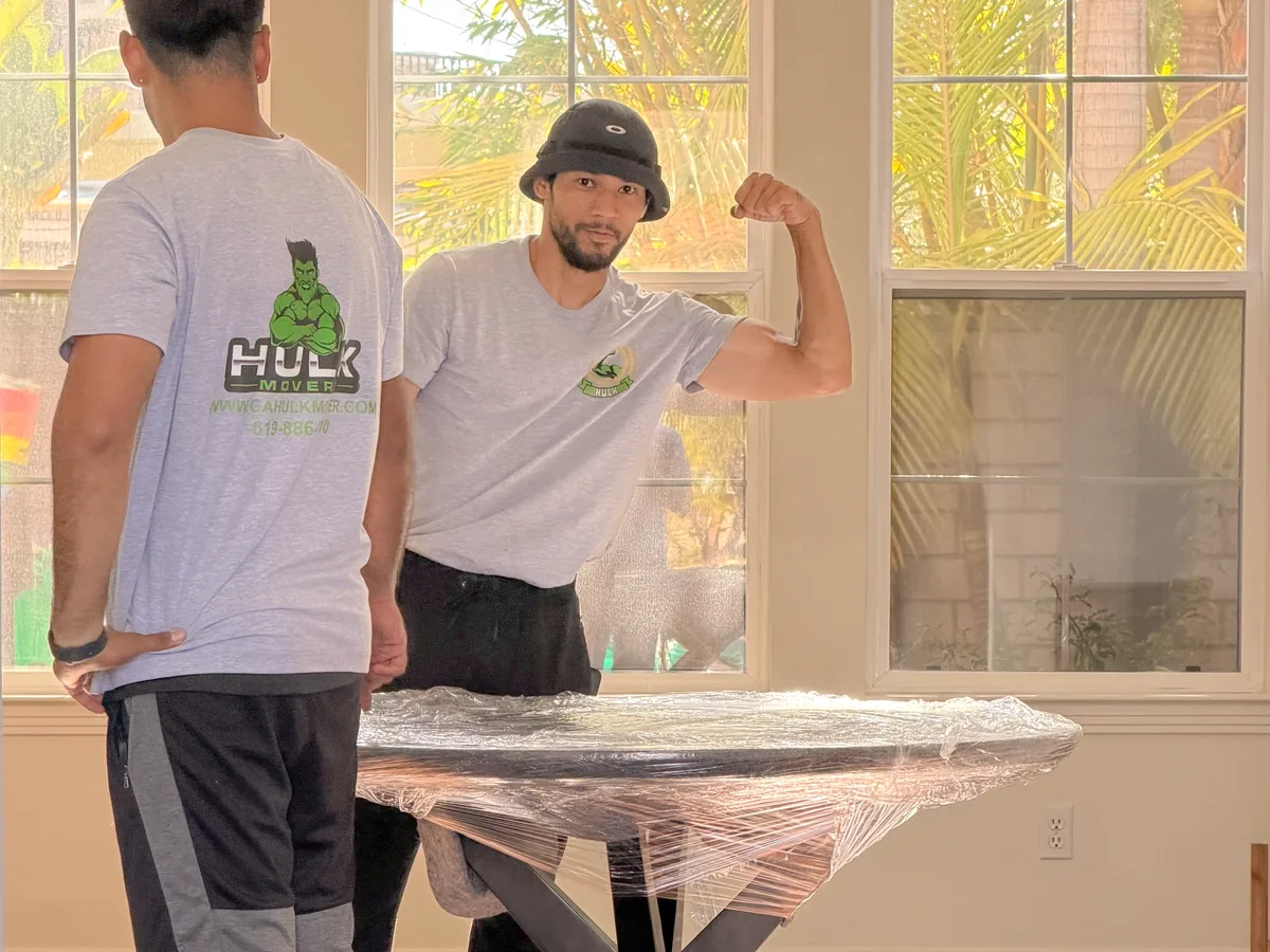 Hulk Movers crew carrying furniture into a San Diego home